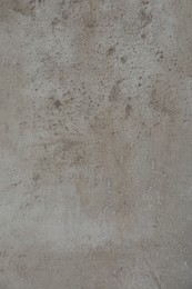 Texture of light grey stone surface as background, closeup