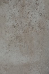 Photo of Texture of light grey stone surface as background, closeup