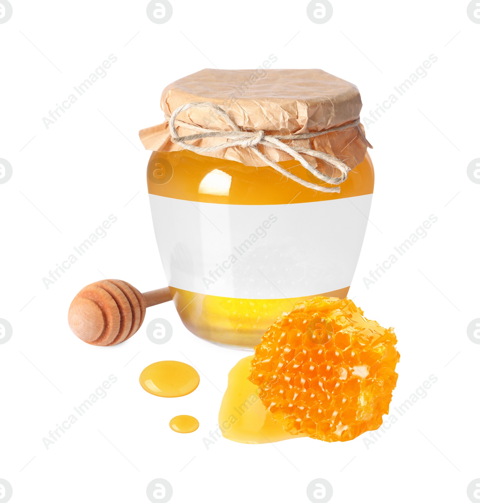 Image of Sweet honey in glass jar with blank label, wooden honey dipper and piece of honeycomb on white background. Mockup for design