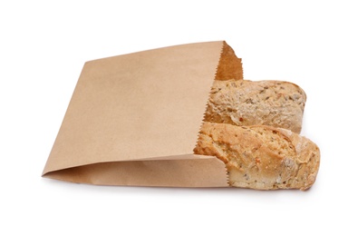 Photo of Paper bag with bread loaves on white background. Space for design