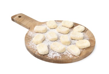 Photo of Making lazy dumplings. Wooden board with cut dough and flour isolated on white