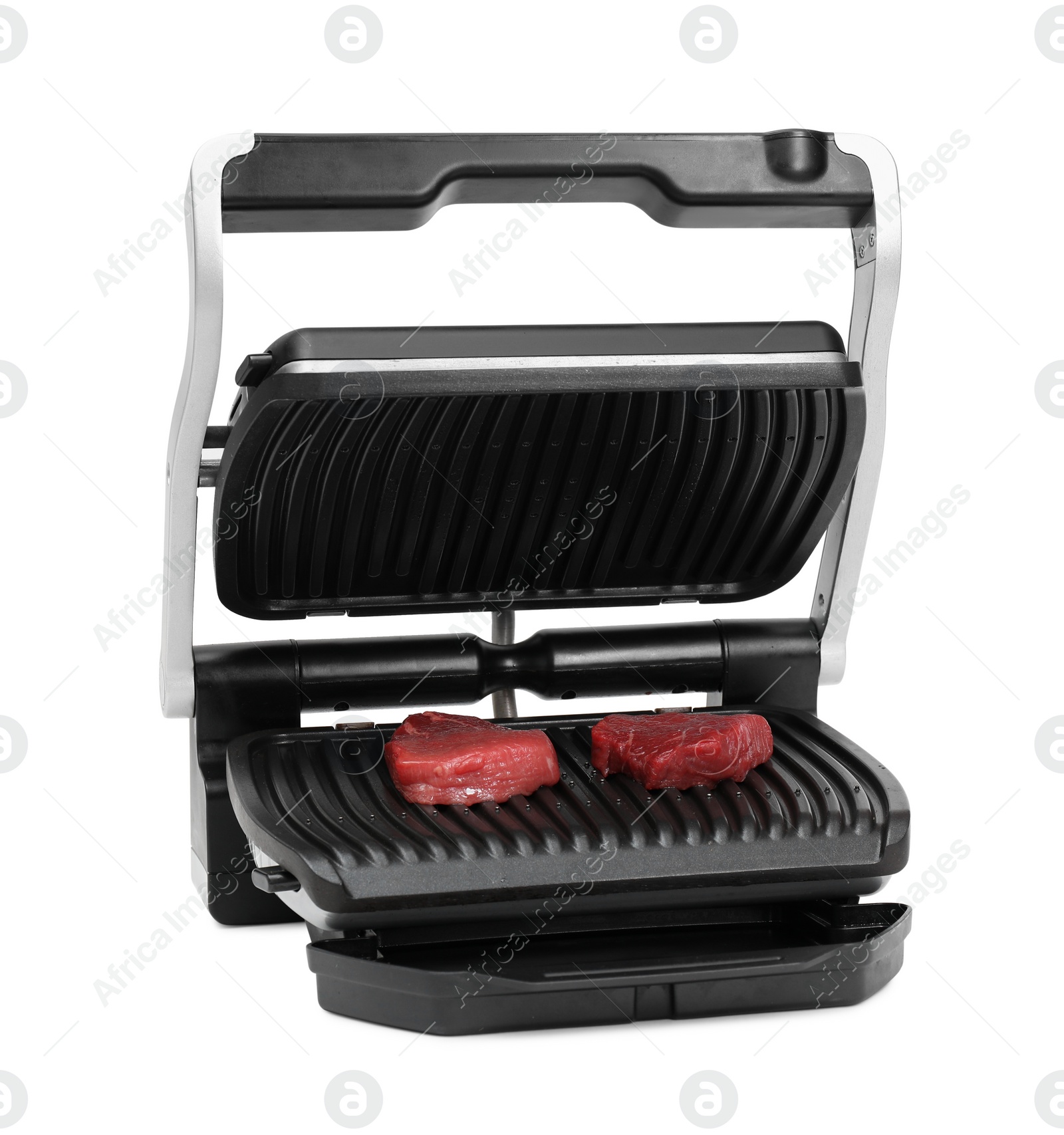 Photo of Electric grill with raw meat steaks isolated on white