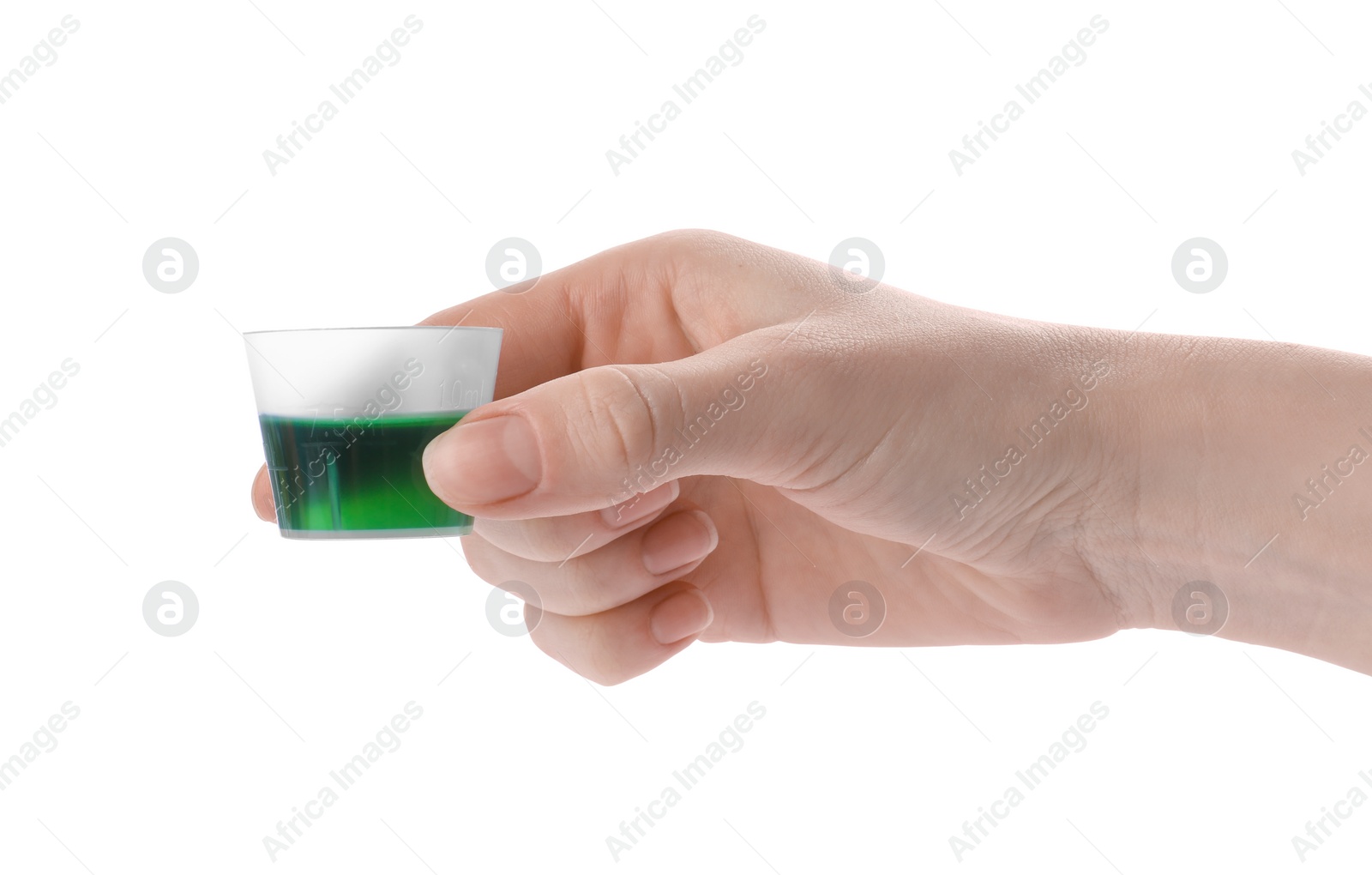 Photo of Woman holding measuring cup with syrup isolated on white, closeup. Cough and cold medicine