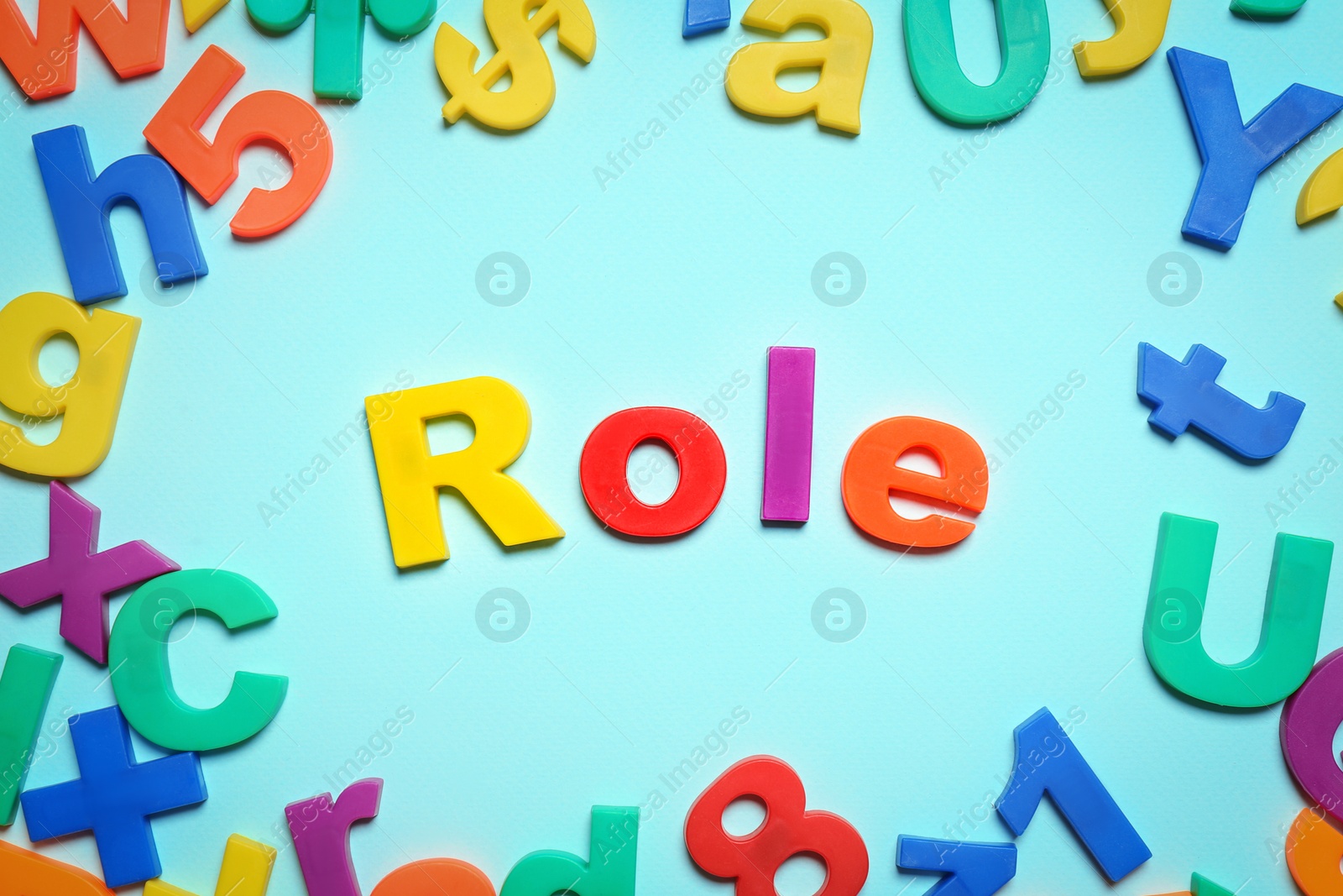 Photo of Word Role made of plastic letters on light blue background, flat lay