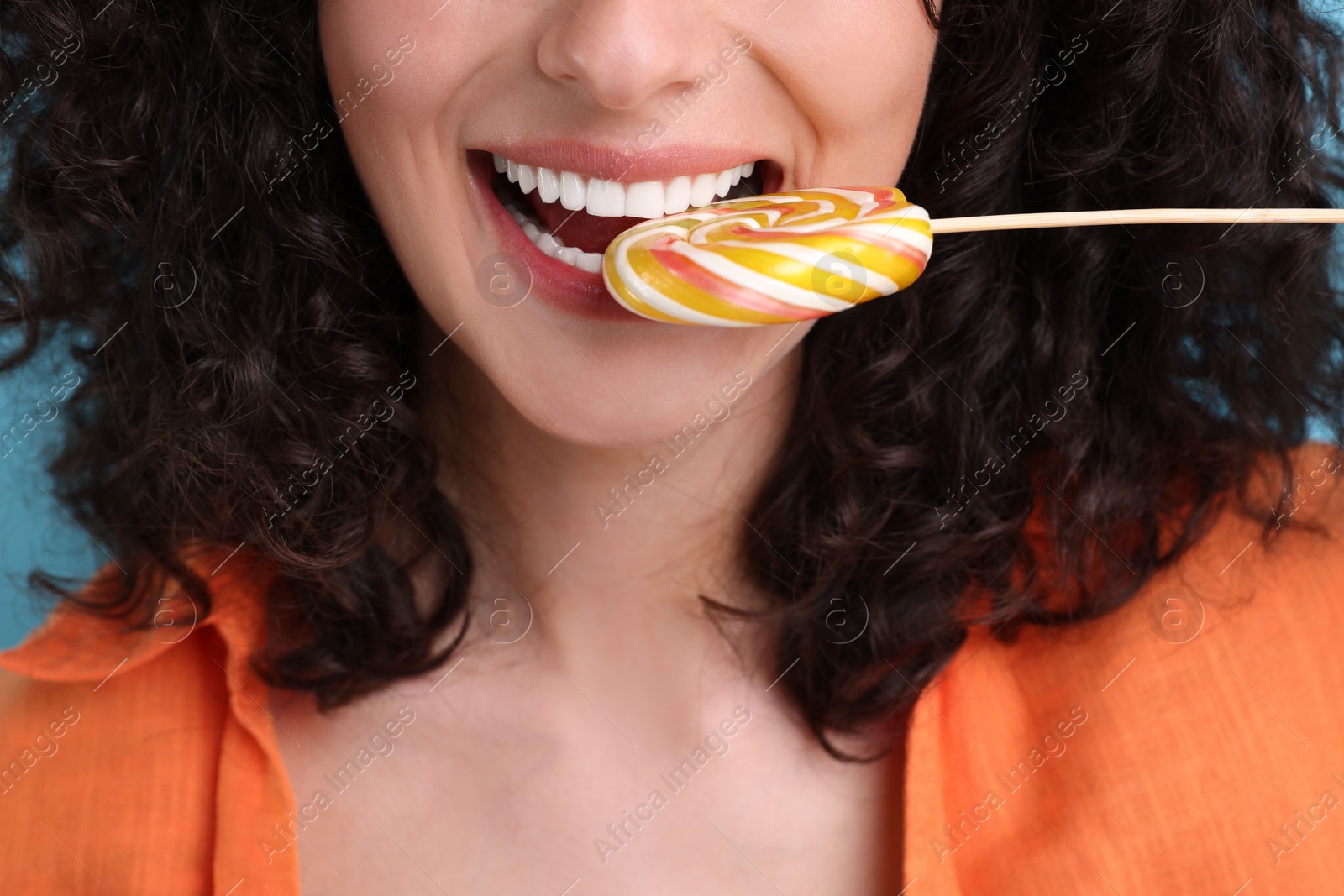 Photo of Woman with tasty colorful lollipop, closeup view