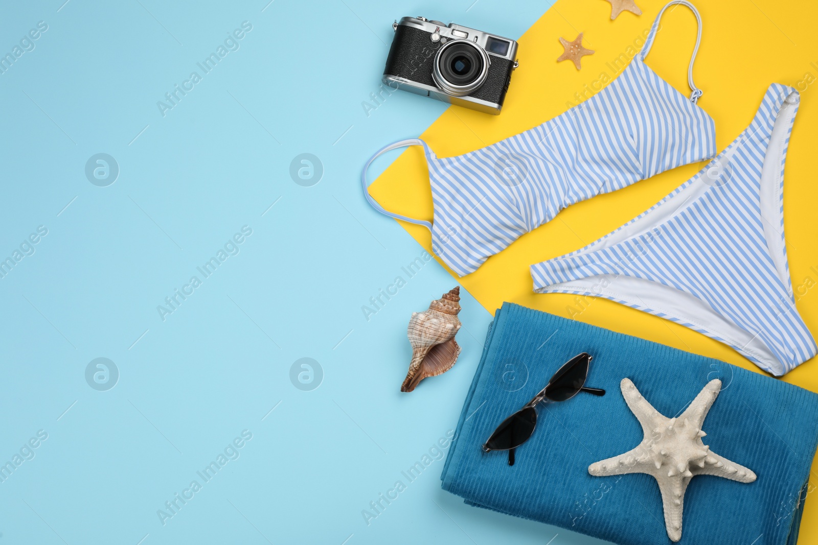 Photo of Flat lay composition with beach objects on color background, space for text