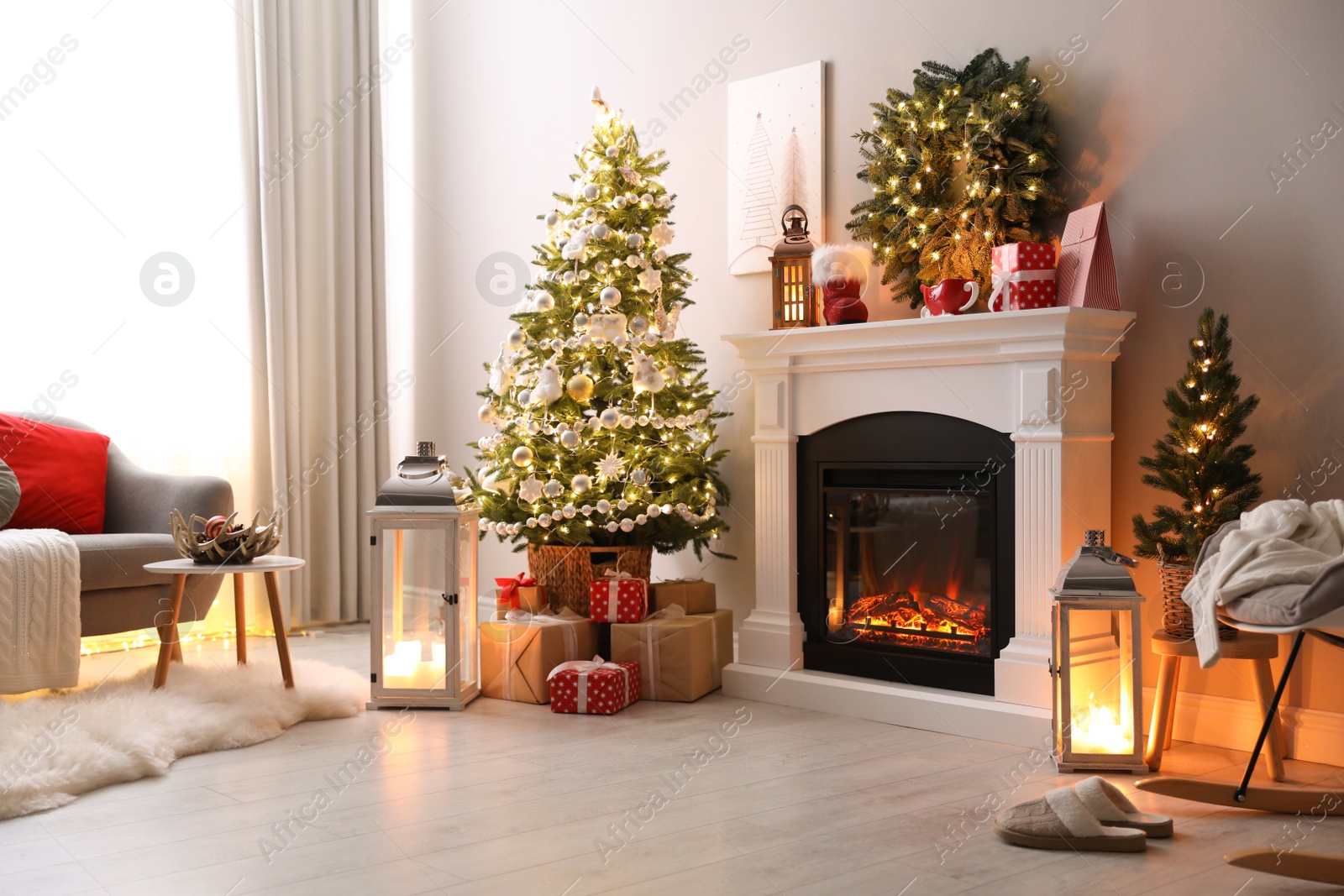 Photo of Stylish living room interior with beautiful fireplace, Christmas tree