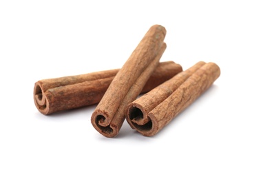 Aromatic cinnamon sticks on white background