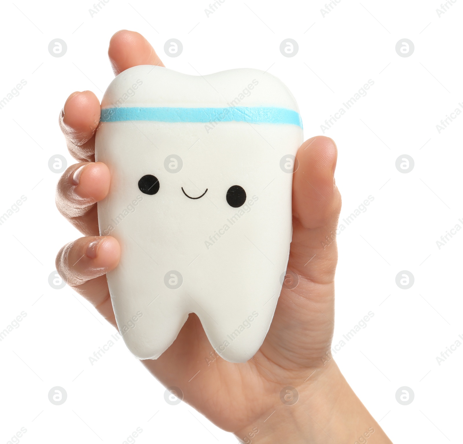 Photo of Woman holding model of tooth with cute face on white background