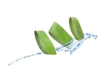 Sliced aloe vera leaf and splash of juice on white background