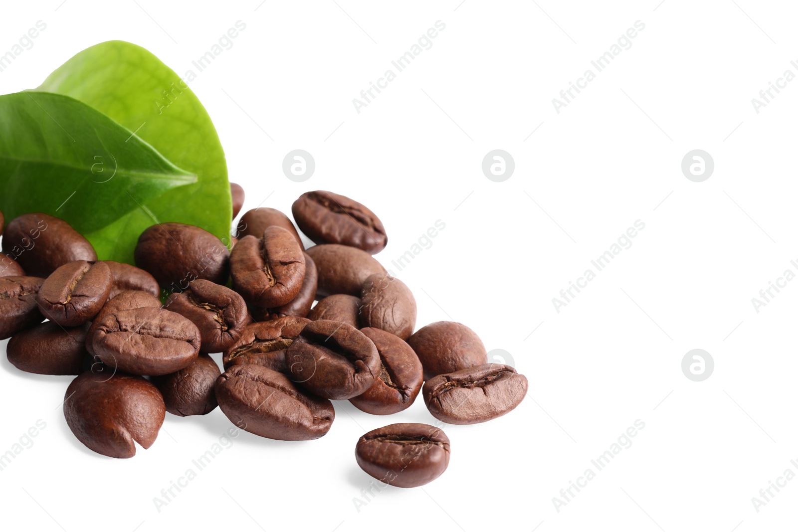 Photo of Roasted coffee beans and leaves isolated on white