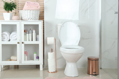 Photo of Stylish toilet bowl in modern bathroom interior