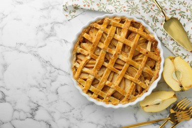 Photo of Tasty homemade quince pie served on white marble table, flat lay. Space for text