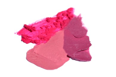 Photo of Smears of bright lipsticks on white background