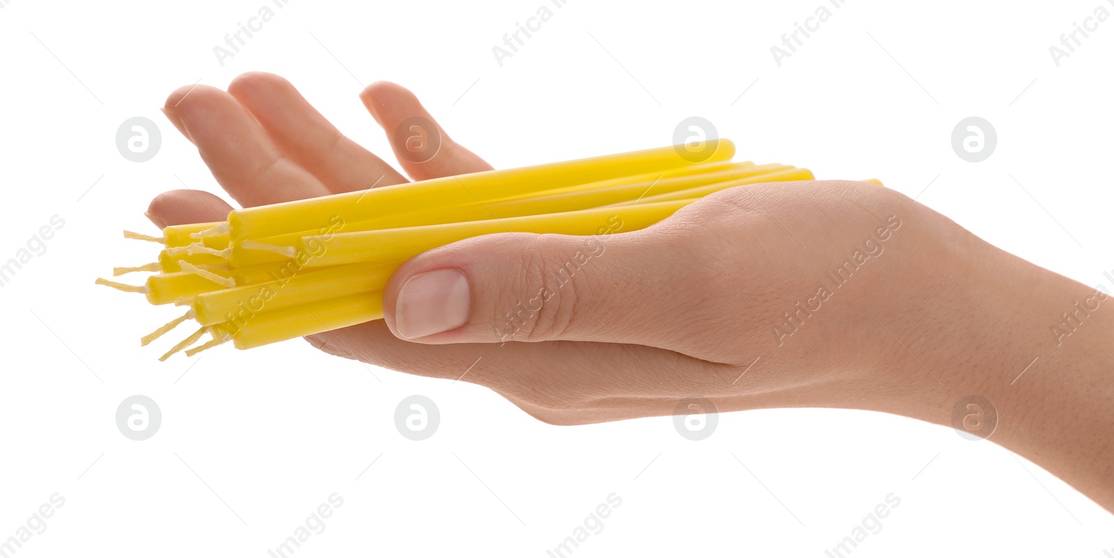 Photo of Woman holding church candles on white background, closeup