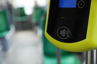 Contactless fare payment device in public transport, closeup. Space for text