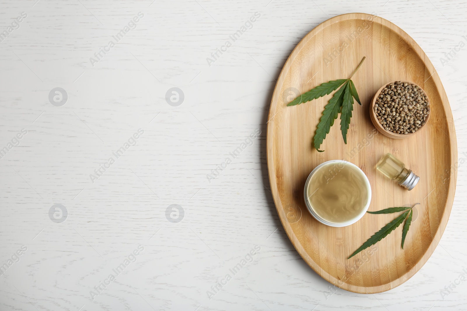 Photo of Flat lay composition with hemp lotion and space for text on white wooden background