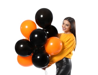 Photo of Beautiful woman with balloons on white background. Halloween party