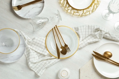 Festive Easter table setting on wooden background, top view