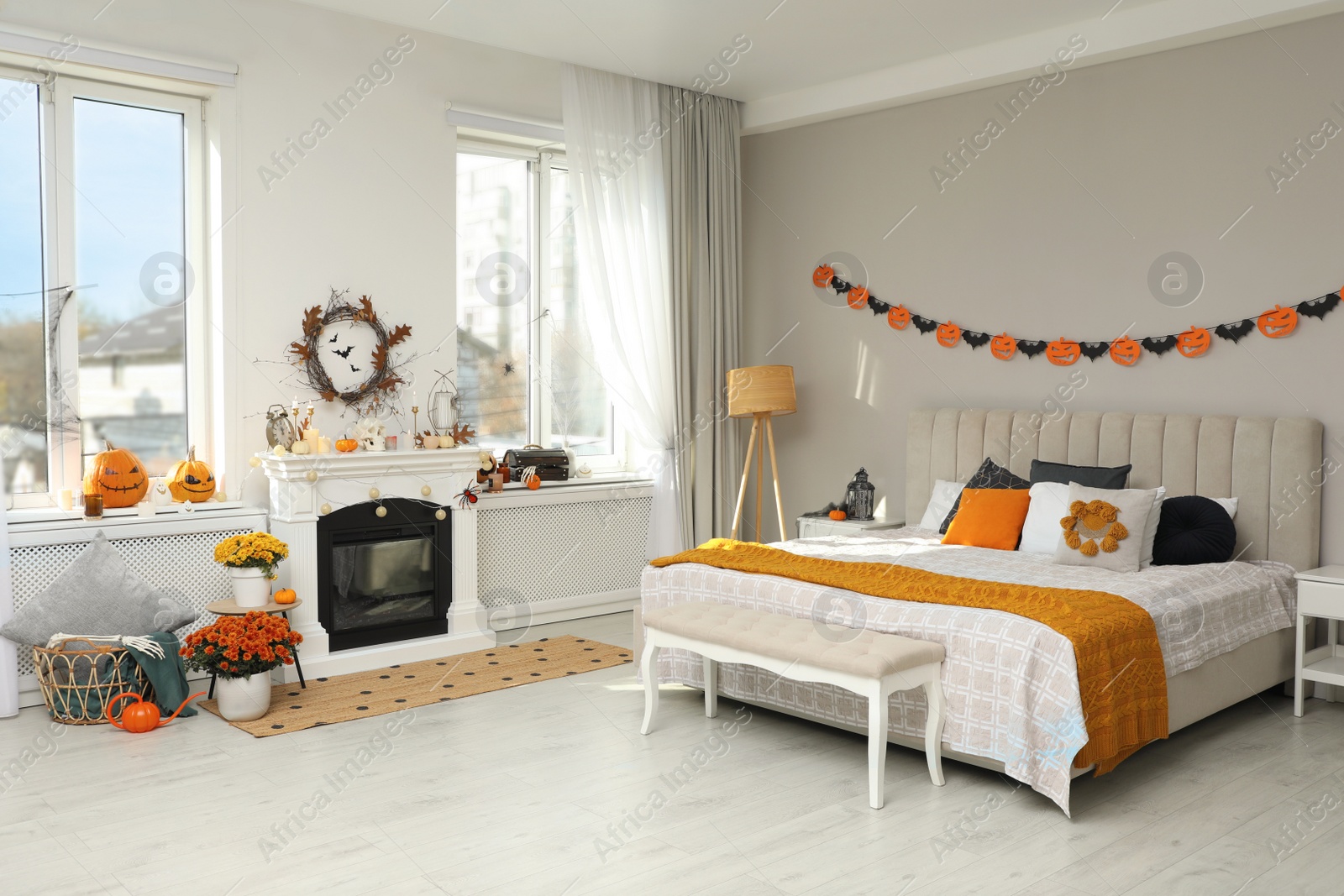 Photo of Modern bedroom decorated for Halloween. Festive interior