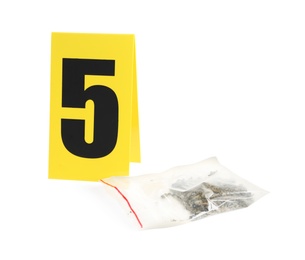 Photo of Plastic bag with cannabis and crime scene marker with number five isolated on white