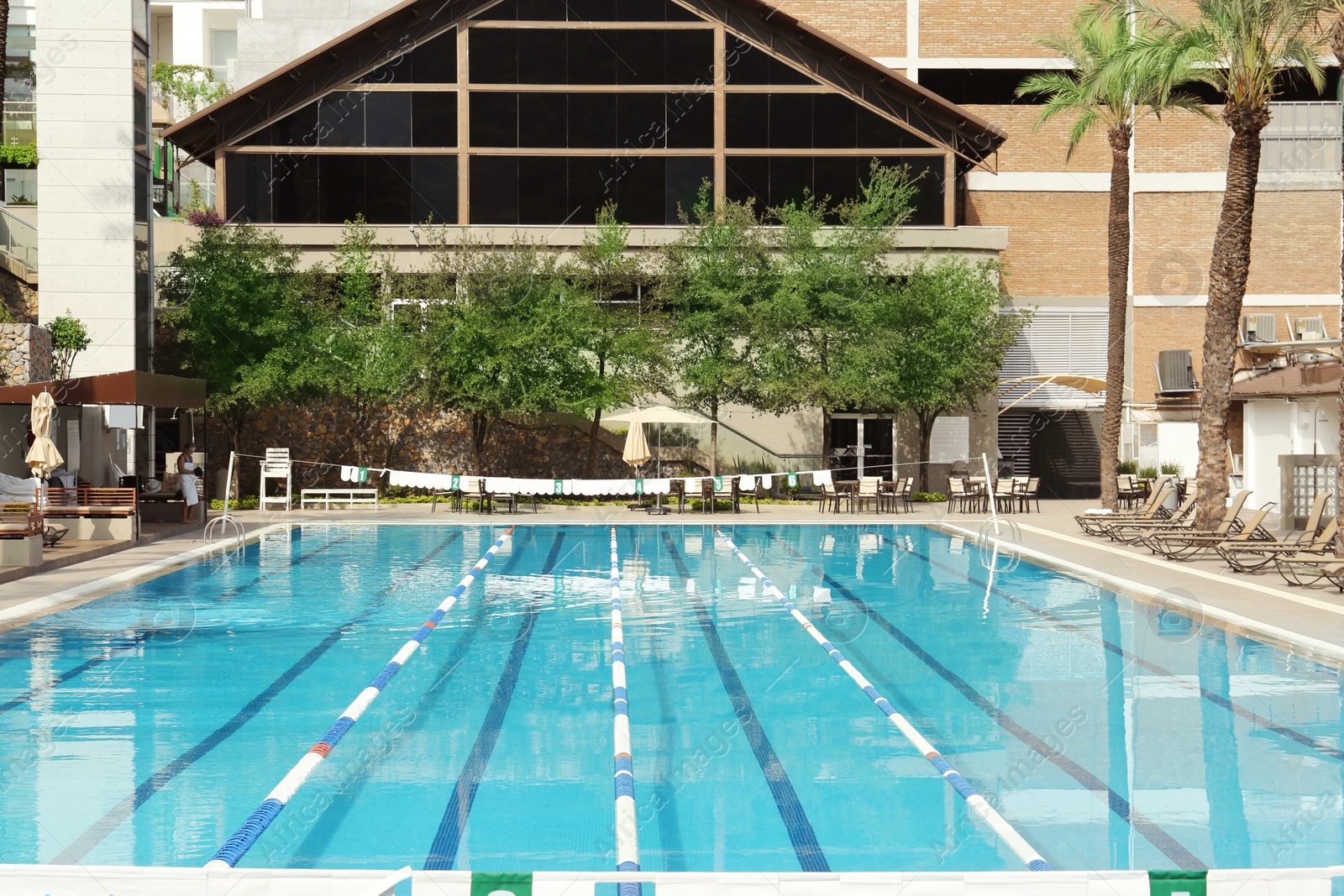 Photo of View on swimming pool and building at luxury resort