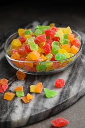 Mix of delicious candied fruits on marble board, closeup