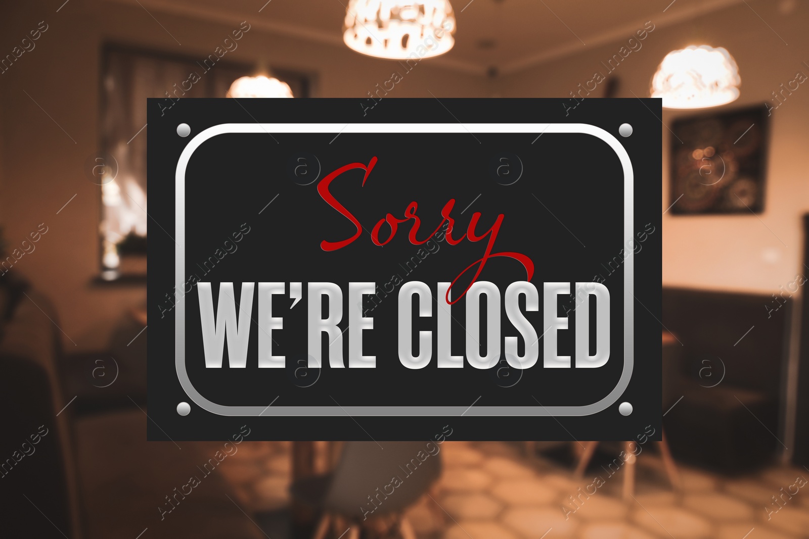 Image of Sorry we are closed sign against blurred background