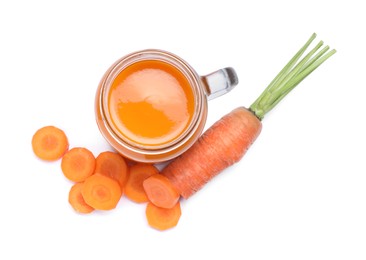 Photo of Freshly made carrot juice in mason jar on white background, top view