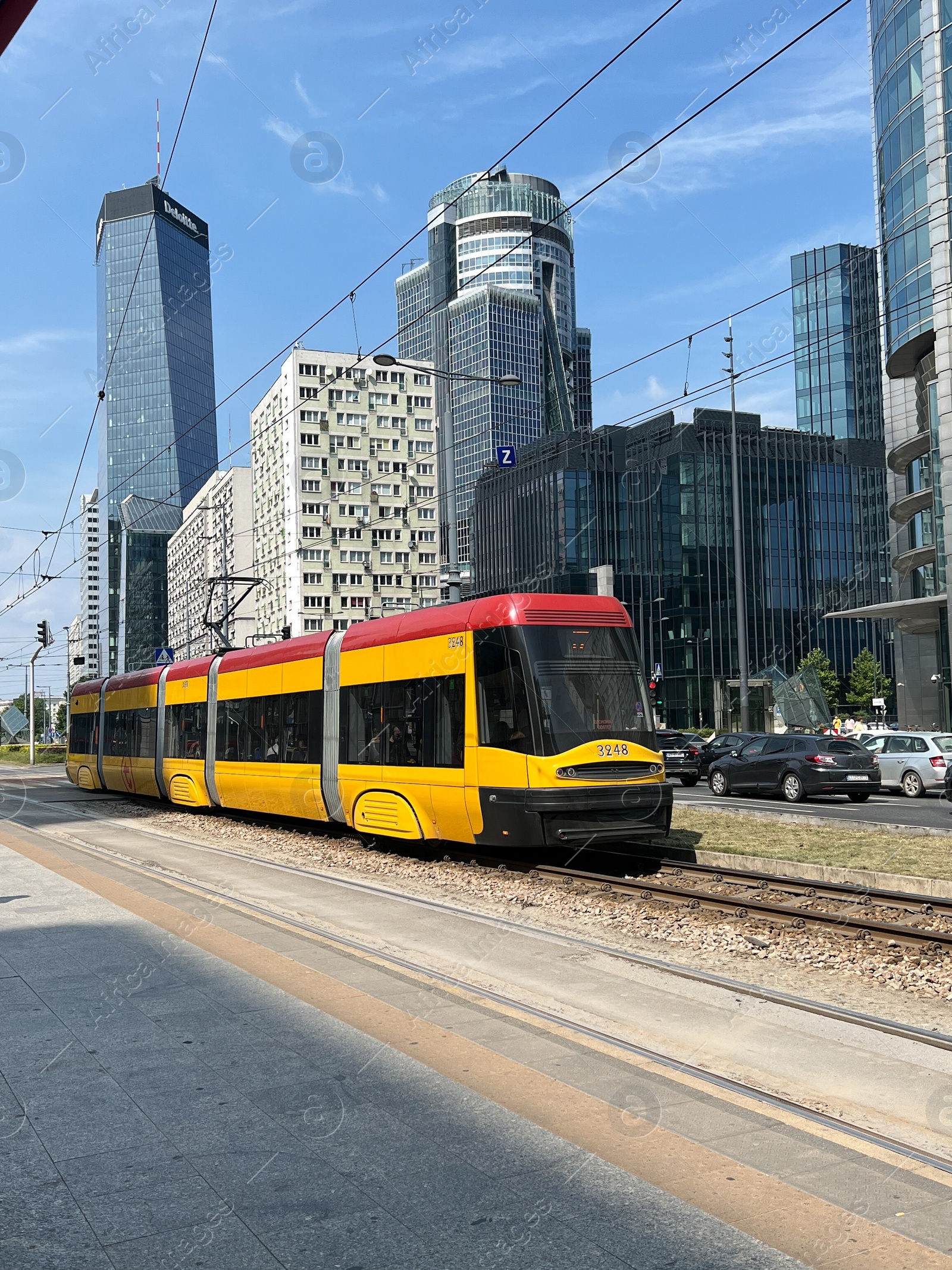 Photo of WARSAW, POLAND - JULY 23, 2022: Modern tram on city street