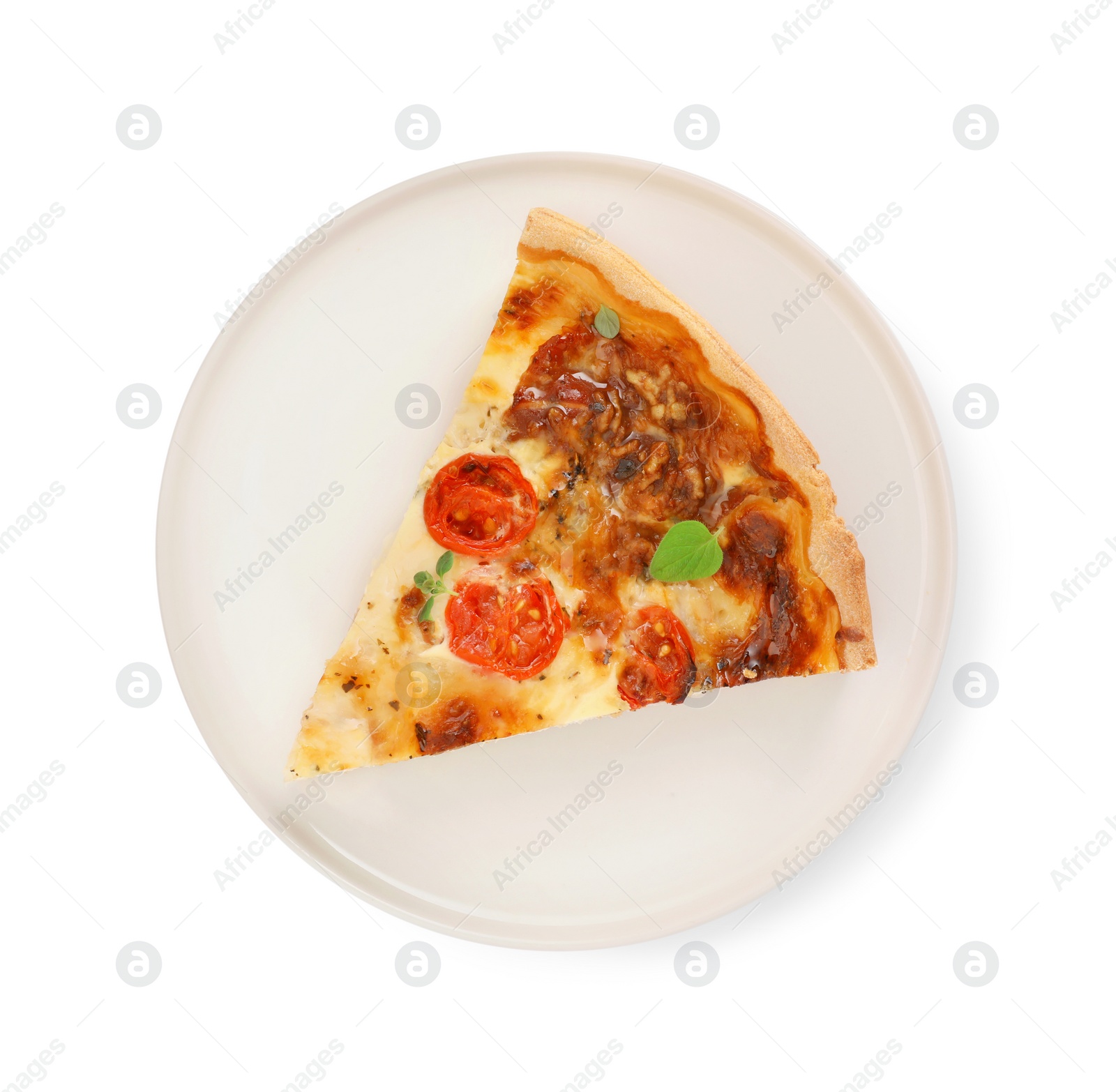 Photo of Piece of delicious homemade quiche prosciutto, tomatoes and greens isolated on white, top view