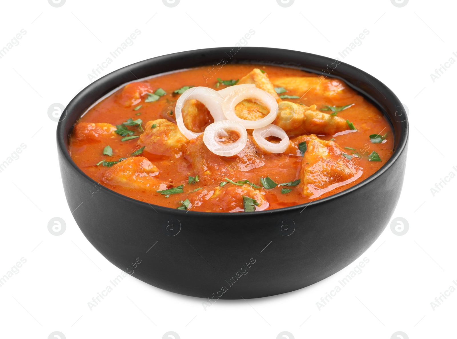 Photo of Bowl of delicious chicken curry on white background