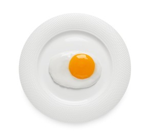 Photo of Plate with tasty fried egg isolated on white, top view