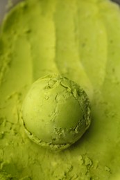 Scoop of tasty matcha ice cream as background, closeup. Space for text