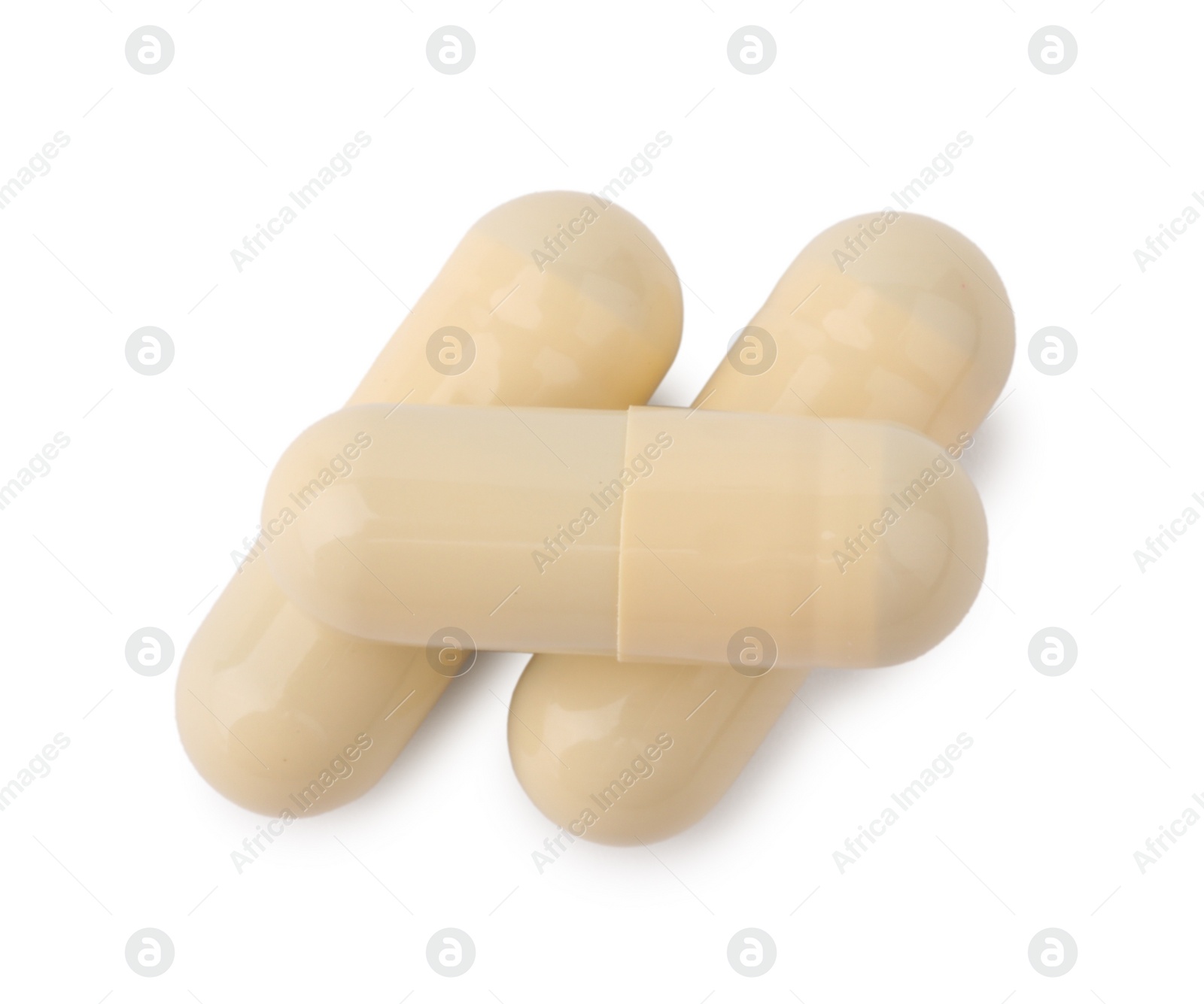 Photo of Vitamin capsules isolated on white, top view