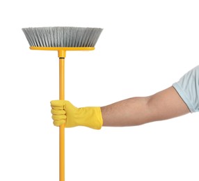 Photo of Young man with yellow broom on white background, closeup