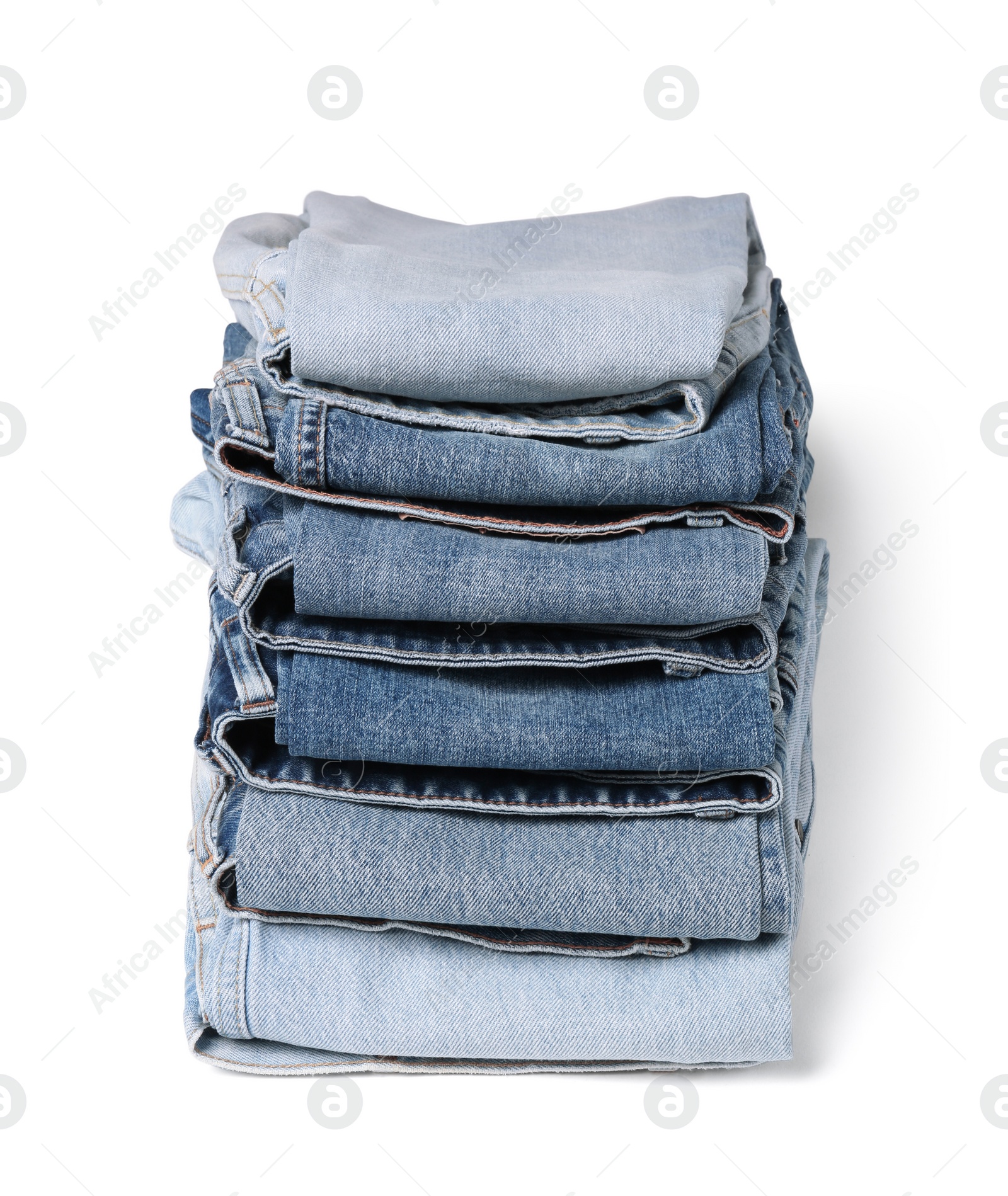 Image of Stack of different folded jeans isolated on white