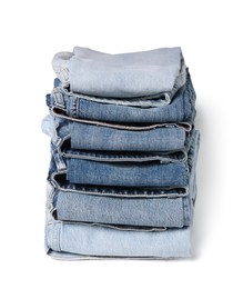 Stack of different folded jeans isolated on white