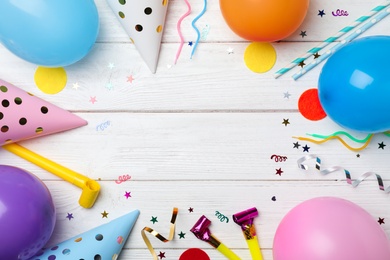 Photo of Flat lay composition with birthday party items on wooden background