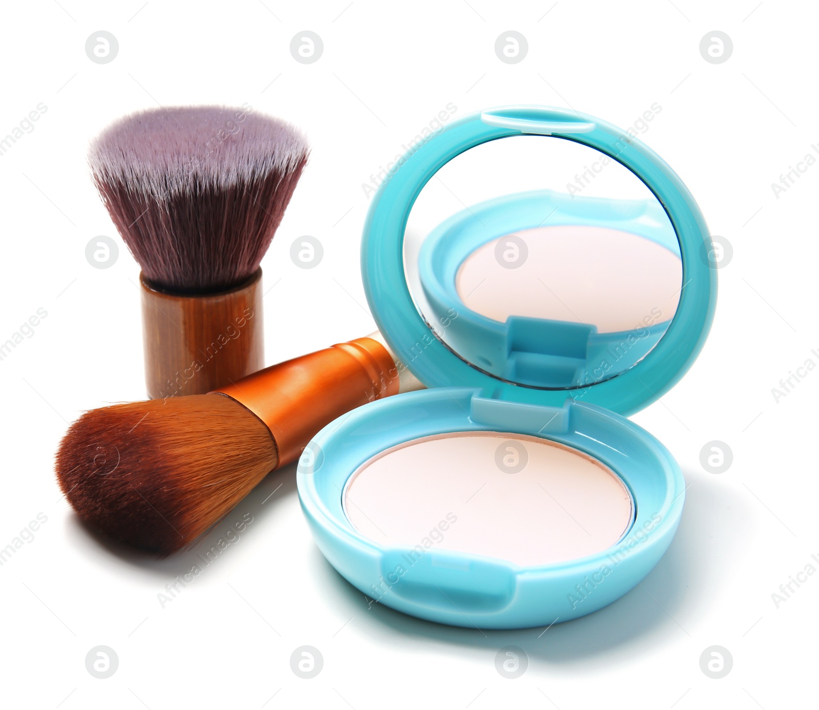 Photo of Face powder with makeup brushes on white background