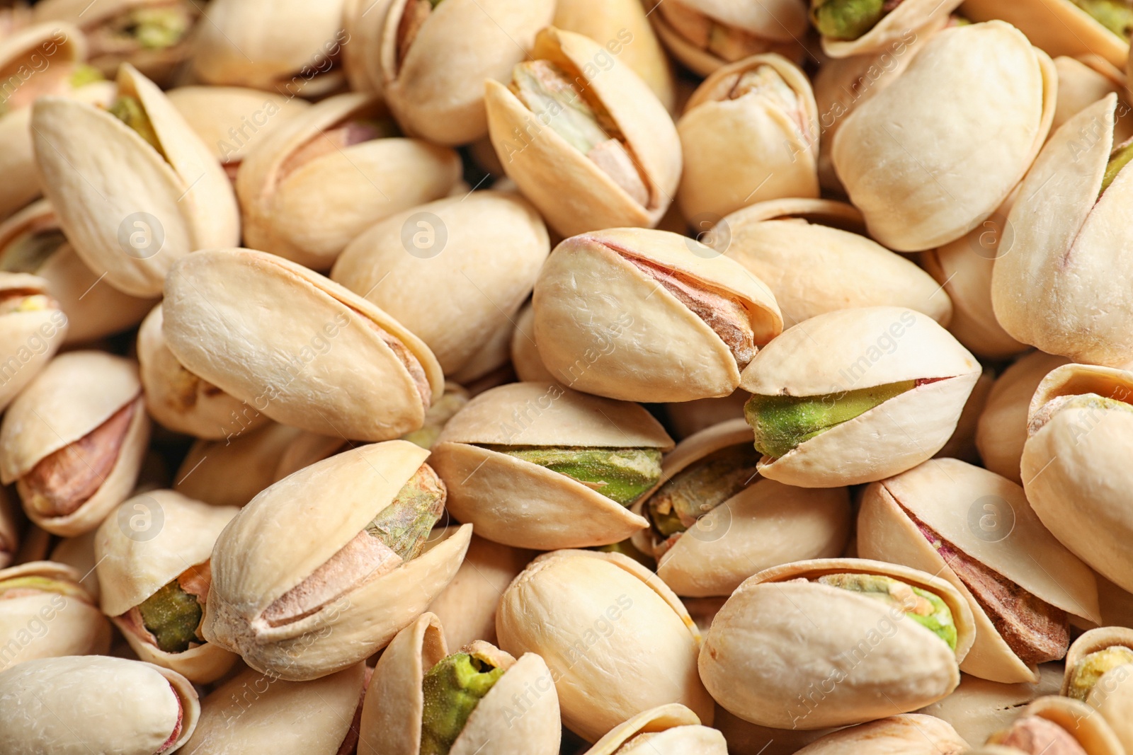 Photo of Organic pistachio nuts in shell as background