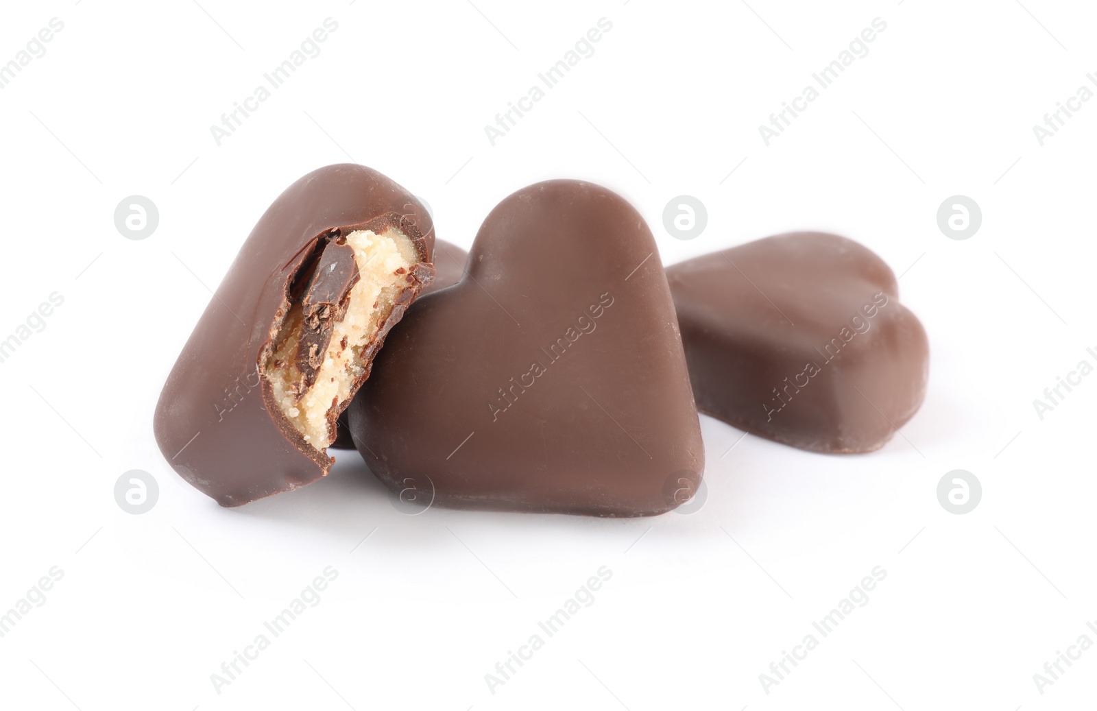 Photo of Beautiful heart shaped chocolate candies on white background