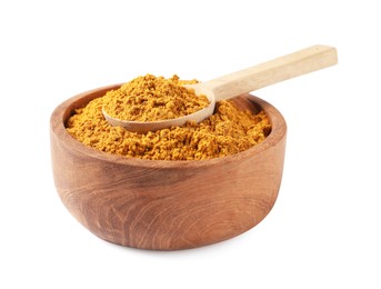 Photo of Dry curry powder in bowl and spoon isolated on white