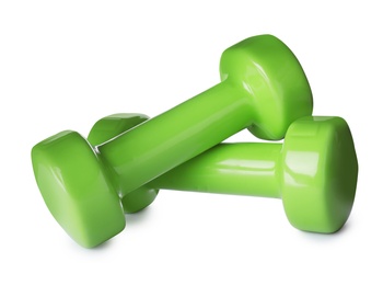 Photo of Color dumbbells on white background. Home fitness