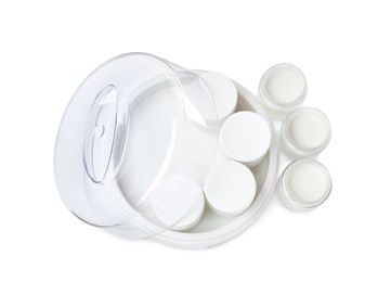 Modern yogurt maker with full jars on white background, top view