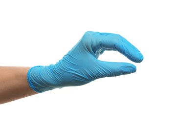 Doctor wearing light blue medical glove holding something on white background, closeup