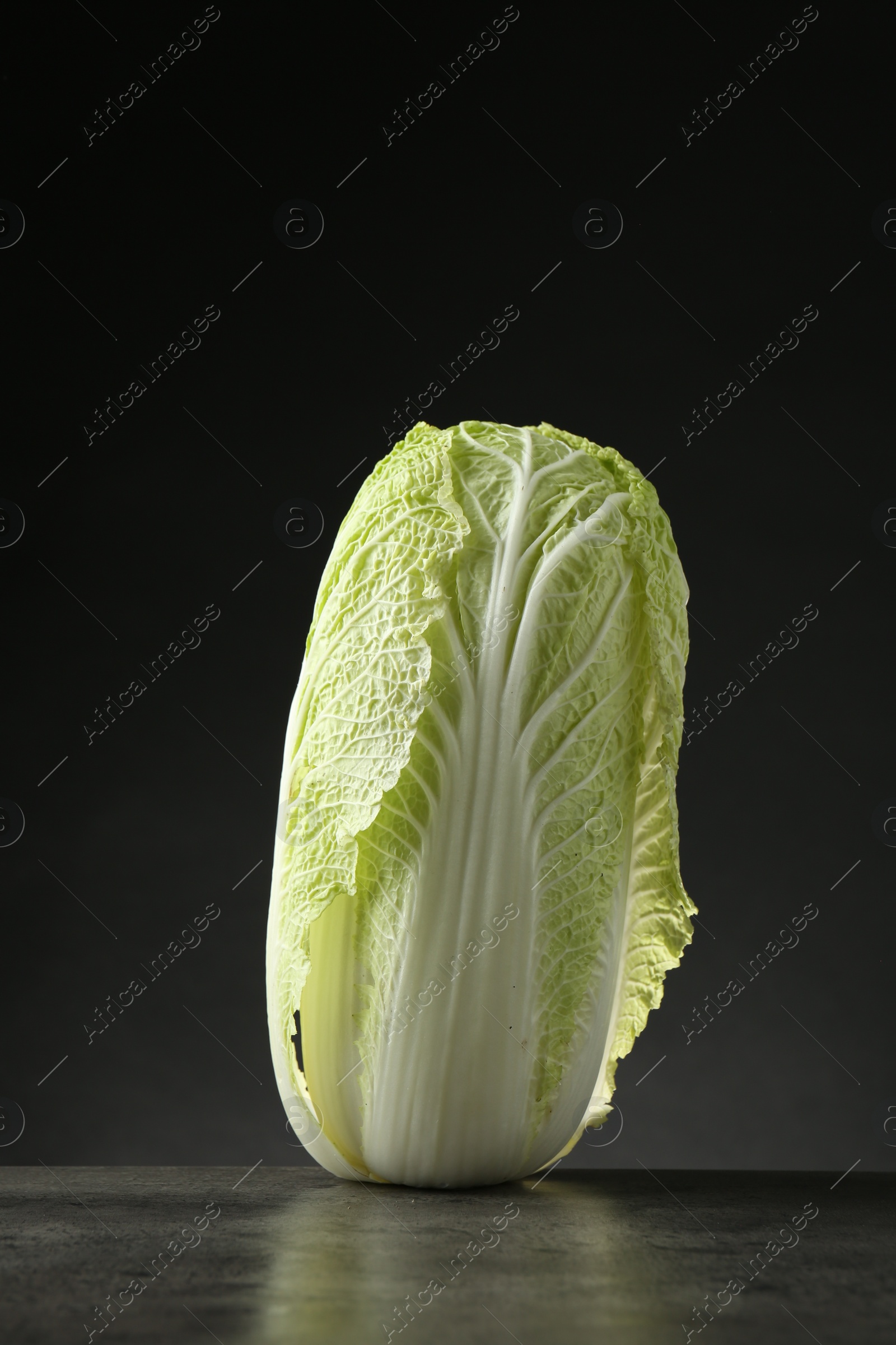 Photo of Fresh ripe Chinese cabbage on grey table