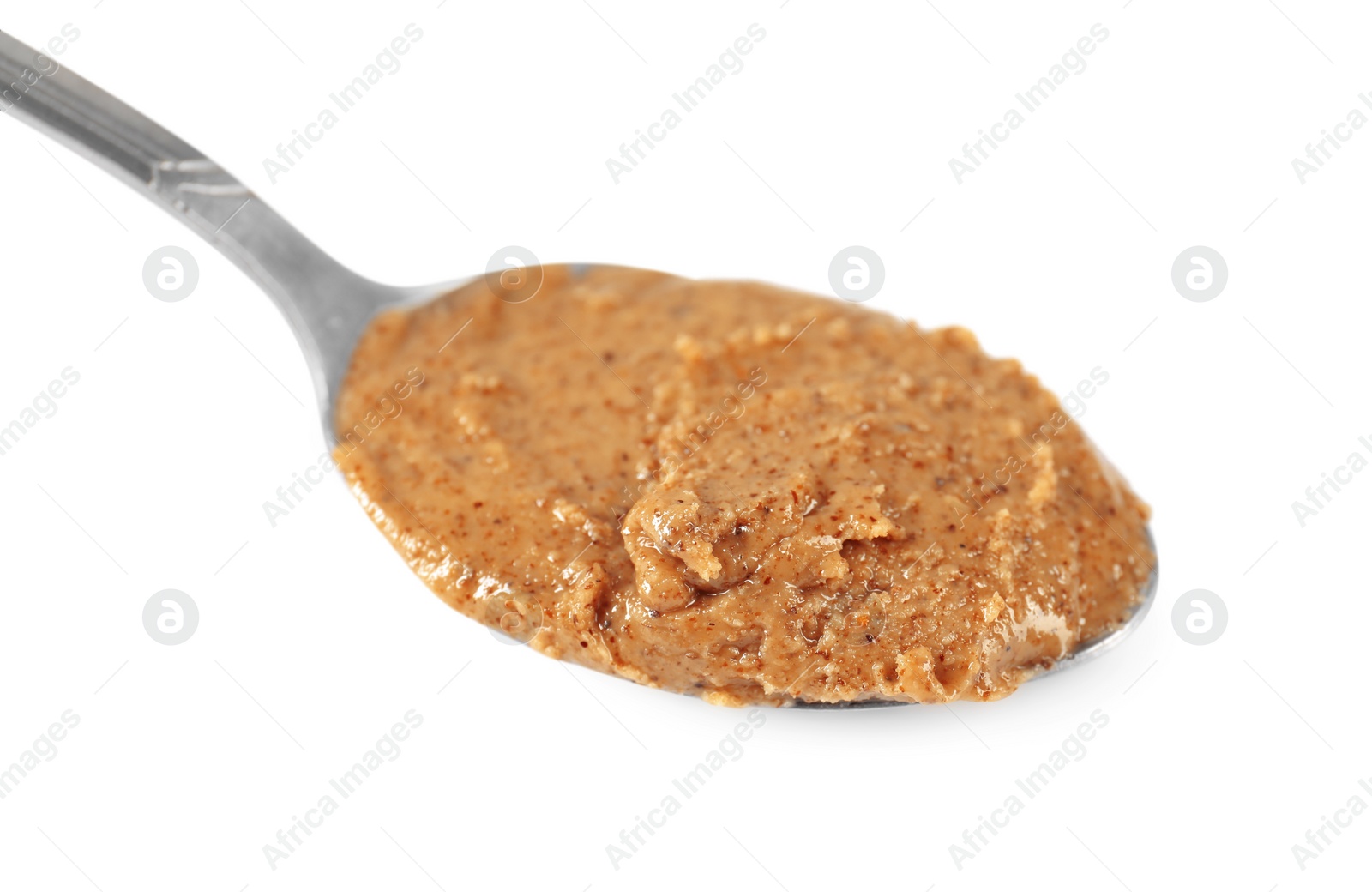 Photo of Delicious nut butter in spoon isolated on white