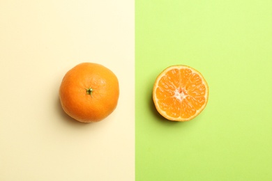 Photo of Flat lay composition with fresh juicy tangerines on color background