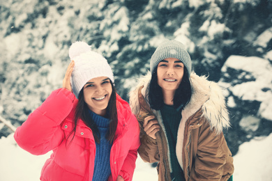 Friends outdoors on snowy day. Winter vacation